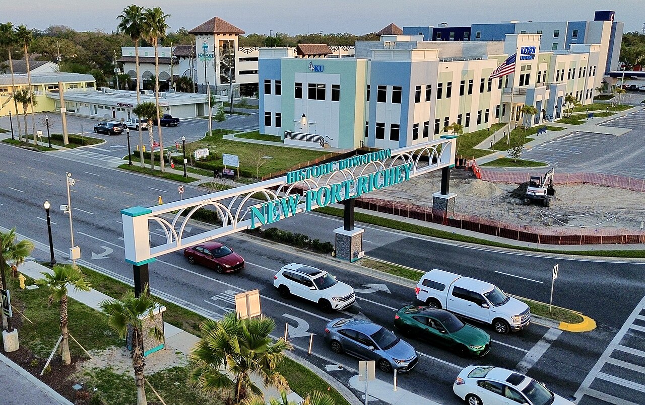 City of New Port Richey welcome marker at a downtown street corner in Florida